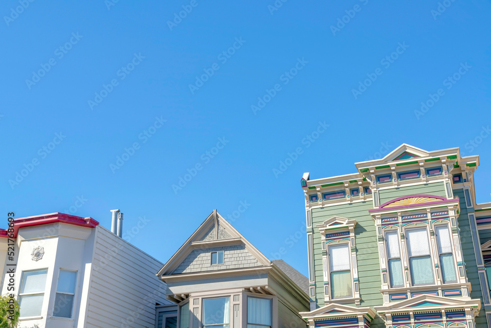Low angle view of houses with different designs against the clear sky in San Francisco, California