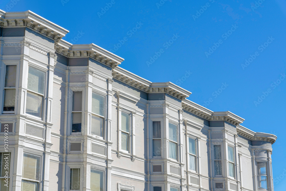 Apartment building exterior with gray walls and bay windows in San Francisco, California Apartment building exterior with gray walls and bay windows in San Francisco, California