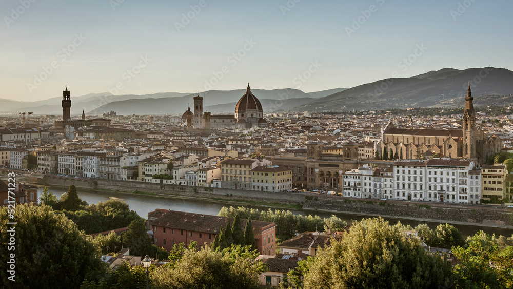 Panoramic view of the center of Florence with gothic cathedral, the Duomo,  named in honor of Santa Maria del Fiore and the river Arno, Italy, Tuscany, at summer sunset 