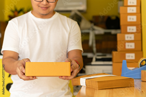 Man wearing white shirt will send the parcel. box delivery concept. Packaging boxes for express delivery. happy man with pick up and delivery with fast delivery service. transportation concept.