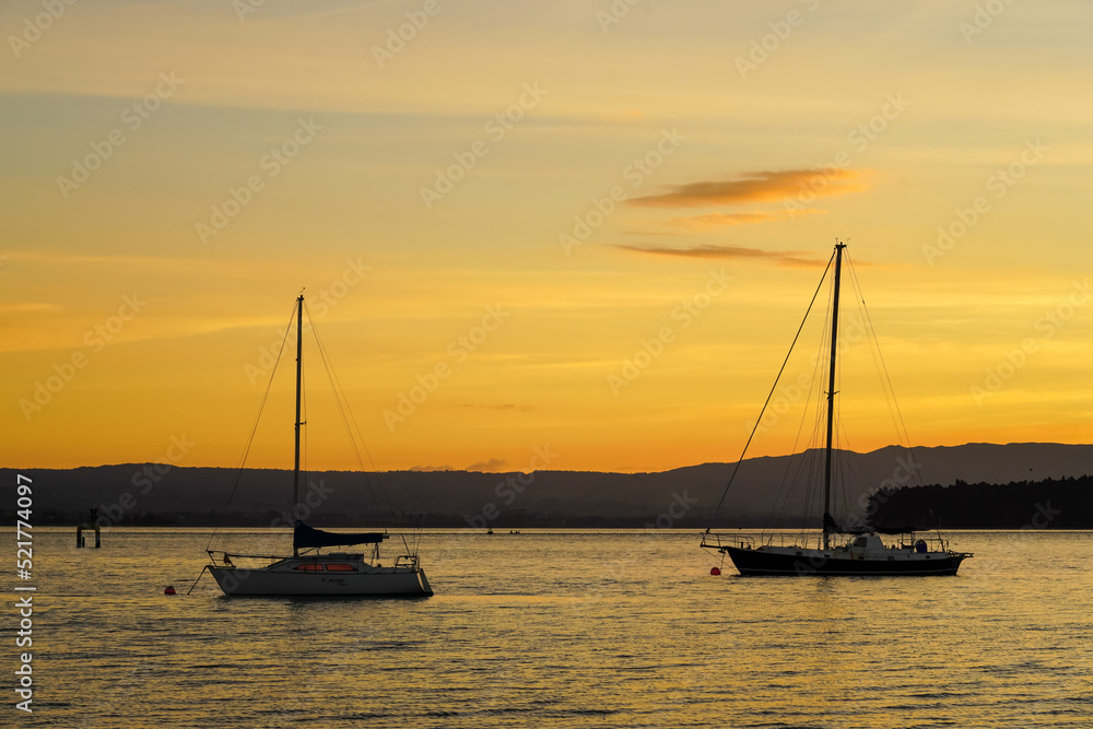 sunset on the sea with boats
