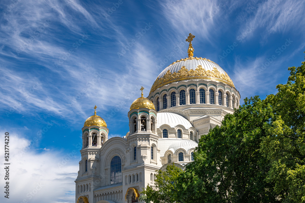 The Naval Cathedral in the city of Kronstadt near St. Petersburg in summer against the background of a blue sky with clouds