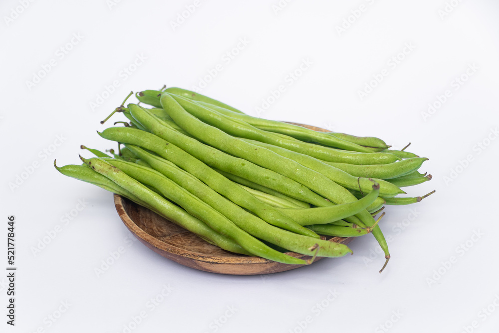 Organic Fresh raw string bean or french beans or Phaseolus vulgaris or common bean on white background. Organic Fresh raw string bean or french beans or Phaseolus vulgaris or common bean on white background.