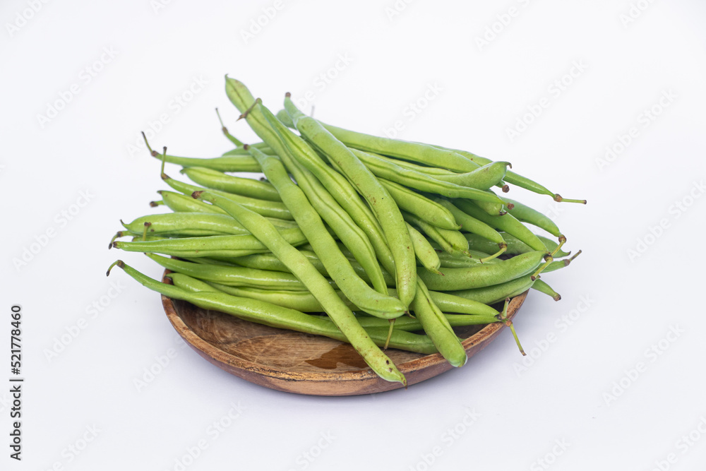 Organic Fresh raw string beans or french beans or Phaseolus vulgaris or common bean on white background. Organic Fresh raw string beans or french beans or Phaseolus vulgaris or common bean on white background.