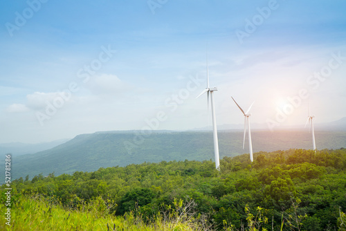 Wind Turbine for alternative energy in landscape of mountain with sunlight background . Eco power, clean energy concept at Khao Yai Thieng Electric Wind Turbine ,Nakhon Ratchasima  province, Thailand photo