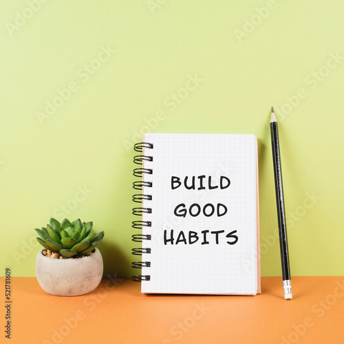 The words build good habits are standing on a notebook, change lifestyle, healthy and positive attitude, motivation concept photo