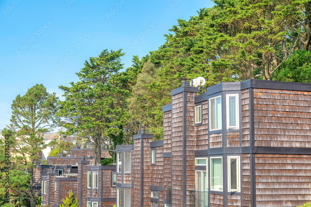Fototapeta premium Apartment complex at San Francisco, California with trees at the back