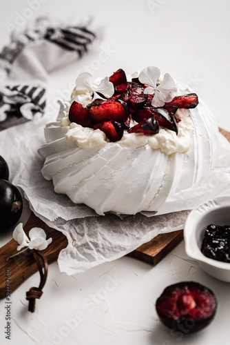 dessert Pavlova cake with cherry plum