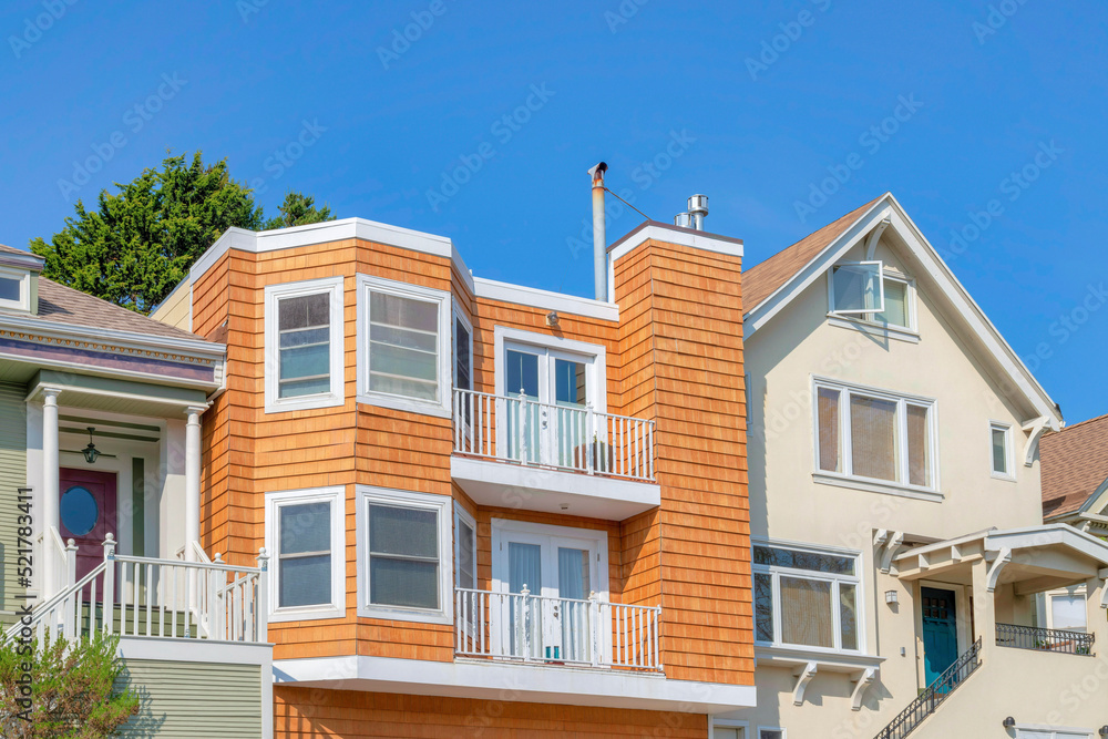 Facade of houses with balconies and stairs at the front doors in San Francisco, California