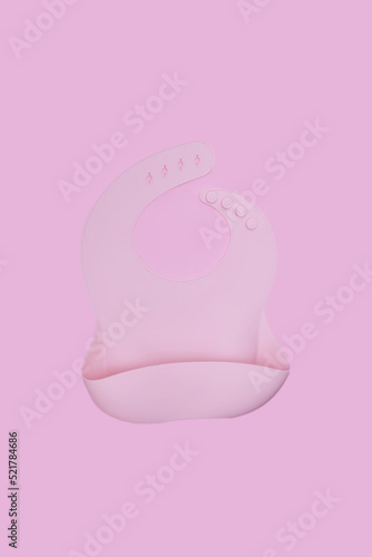 Pink silicone bib on pink background