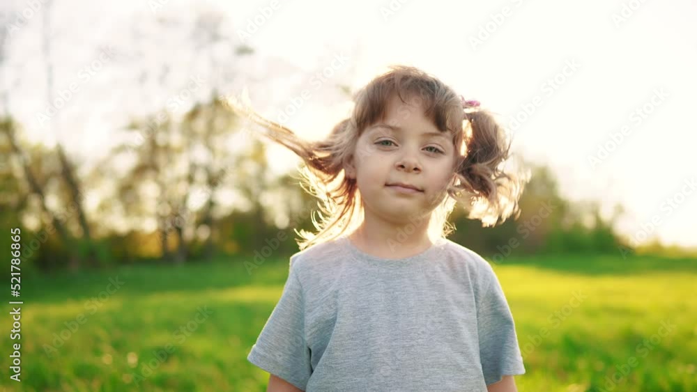 people in the park. portrait little girl outdoors sunlight. happy family kid dream concept. child a girl kid portrait close-up in the park glare. happy cute baby in summer outdoors close up portrait people in the park. portrait little girl outdoors sunlight. happy family kid dream concept. child a girl kid portrait close-up in the park glare. happy cute baby in summer outdoors close up portrait