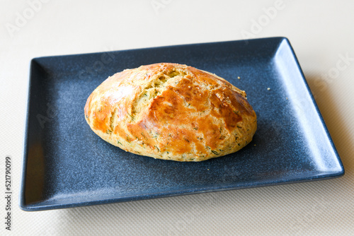 Turkish pastry product , tasty pogaca. Simit, gevrek. Turkish Pastries; peynirli, patatesli, kasarli pogaca, borek, acma, ay coregi at patisserie showcase. photo