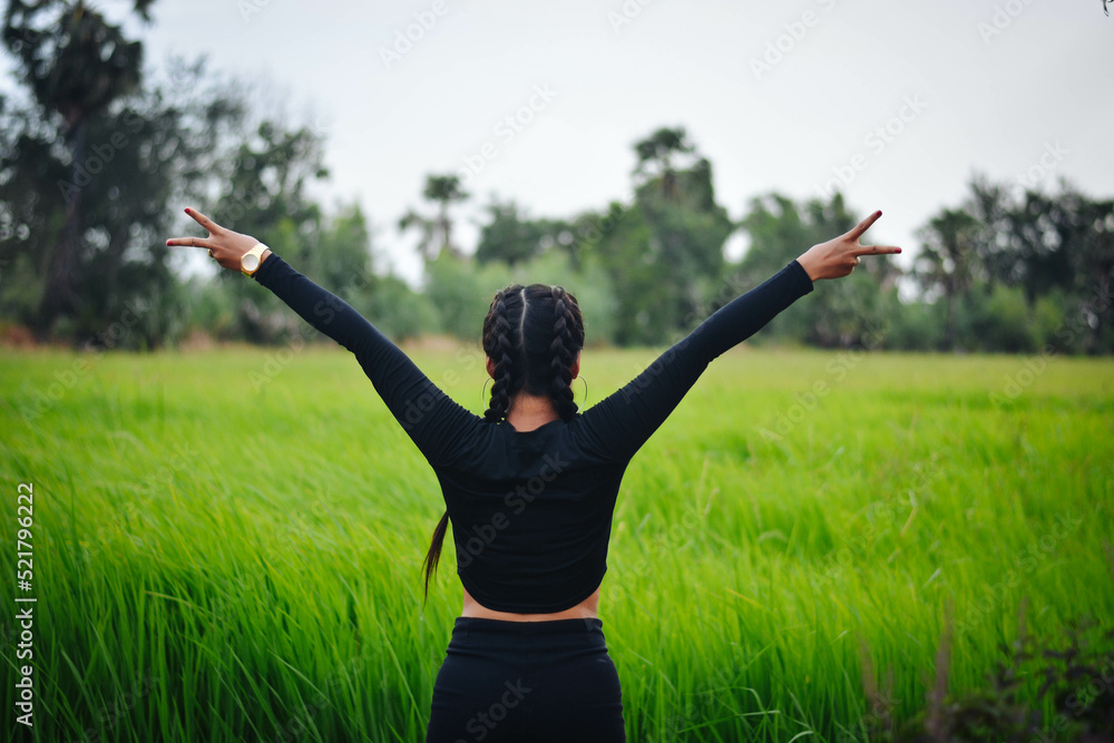 Sexy women are lifting their hands in a cheerful manner in nature. Sexy women are lifting their hands in a cheerful manner in nature.