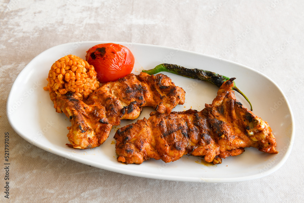 Chicken wings barbeque in a dish with BBQ grill sauce . Izgara tavuk kelebek sis kanat. Tavuk sis, gogus. Chicken wings barbeque in a dish with BBQ grill sauce . Izgara tavuk kelebek sis kanat. Tavuk sis, gogus.