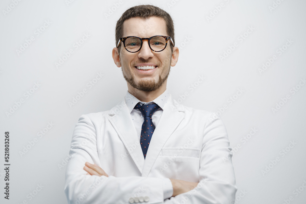 Portrait of male doctor smiling isolated on white background Portrait of male doctor smiling isolated on white background