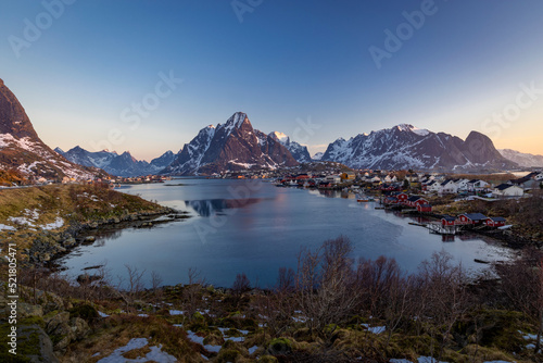 norwegian landscape with sea on the foreground and snowy mountains on the background, lofoten sunny weather with blue sky. Reine © zdenek
