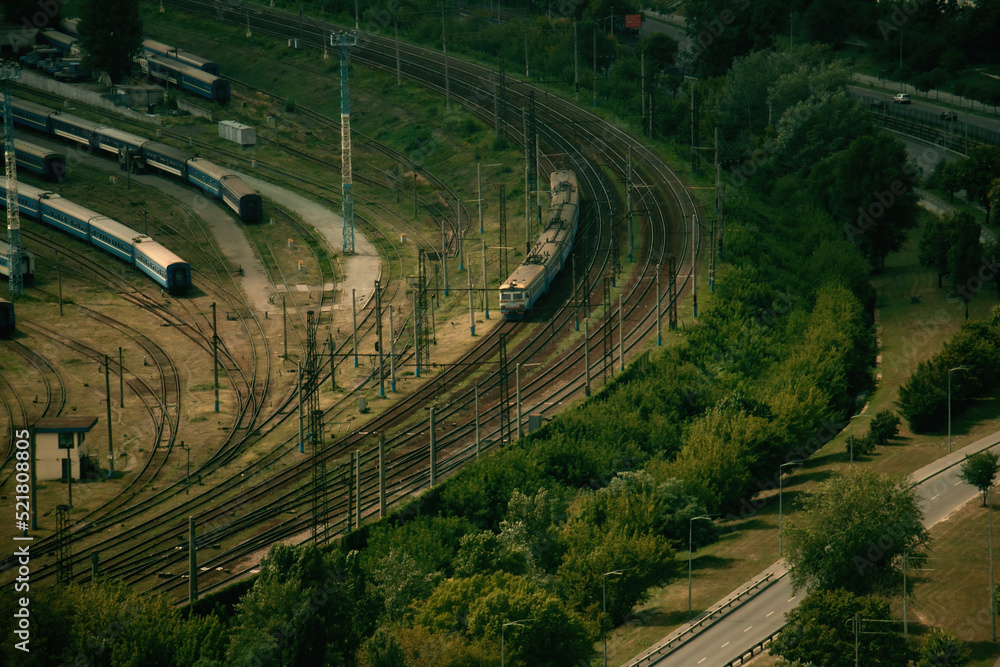 Railway depot in Kyiv and a moving train from a bird's eye view