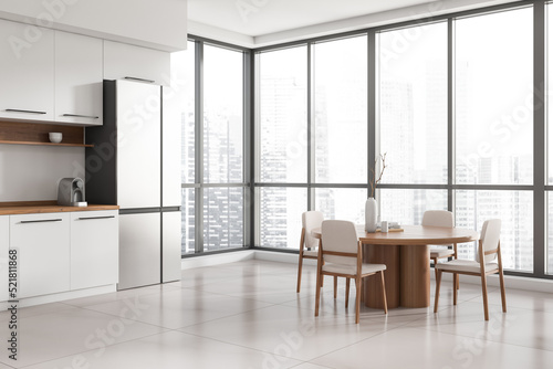 Modern kitchen interior with eating table and chairs  panoramic window