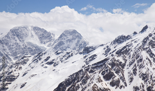 Panorama of a colored mountain landscape with the snow covered mountains