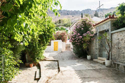 Fototapeta Naklejka Na Ścianę i Meble -  Street in small mediterranean town in sunny summer day