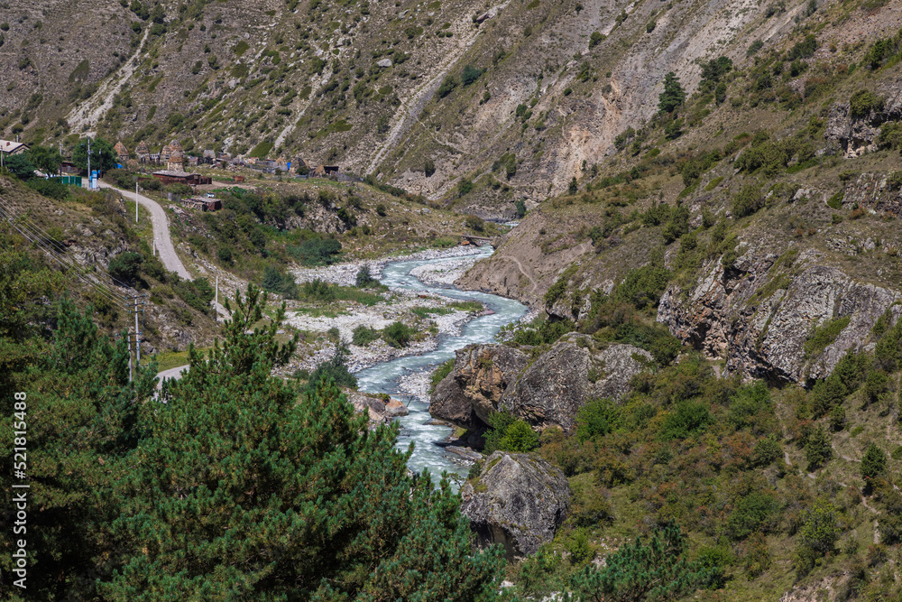 Mountain river high in the mountains of North Ossetia. Stormy current. Mountain river high in the mountains of North Ossetia. Stormy current.