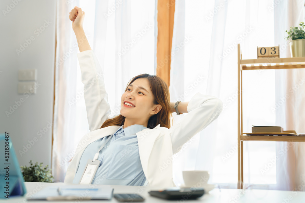 Successful business concept, Businesswoman raising arm to stretching after hard working new project Successful business concept, Businesswoman raising arm to stretching after hard working new project