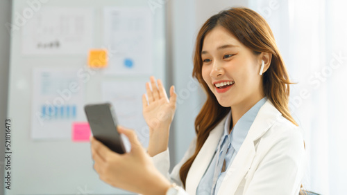 Successful business concept, Businesswoman use video call on smartphone to greeting with colleague © Pichsakul