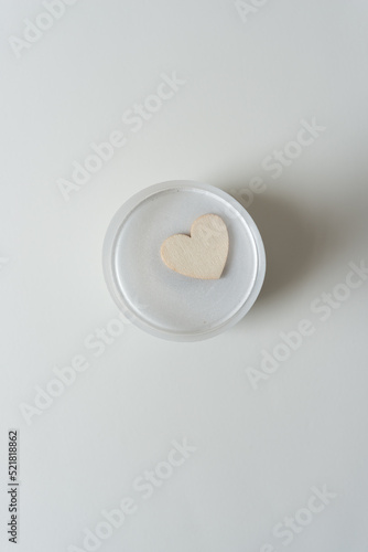 wooden heart isolated inside a plastic object