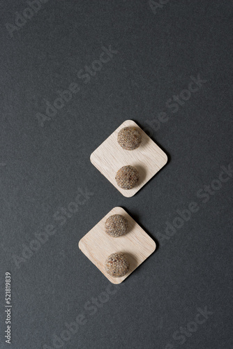Fototapeta Naklejka Na Ścianę i Meble -  brown cloth buttons on wooden squares