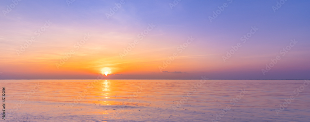 Beautiful sunset beach seascape, summer vacation holiday template banner. Calm waves with amazing blue ocean lagoon, sea shore, coastline. Amazing inspirational view. Relaxing bright beach seaside