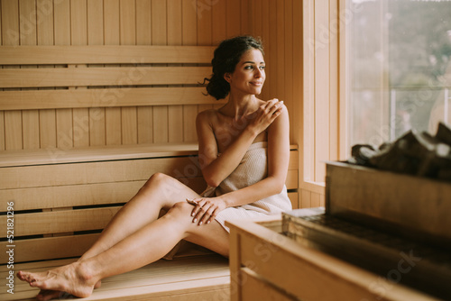Принти на полотні Young woman relaxing in the sauna