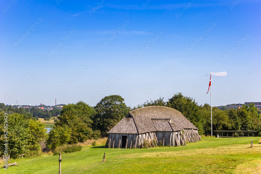 Recontructed Viking longhouse in the rolling landscape of Fyrkat near Hobro