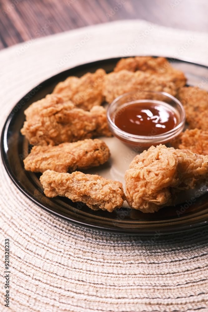 Crispy fried chicken wings on a plate top view . Crispy fried chicken wings on a plate top view .