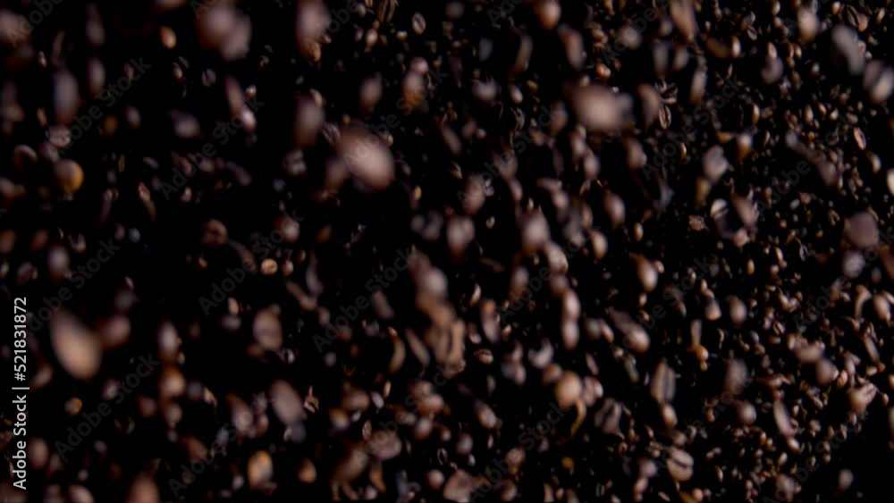 Downfall heap coffee grains on dark background. Roasted fragrant beans falling. Downfall heap coffee grains on dark background. Roasted fragrant beans falling.