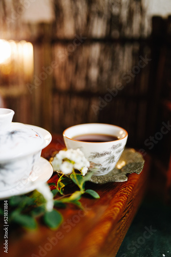 Fototapeta Naklejka Na Ścianę i Meble -  drinking Chinese tea on the background of a teapot