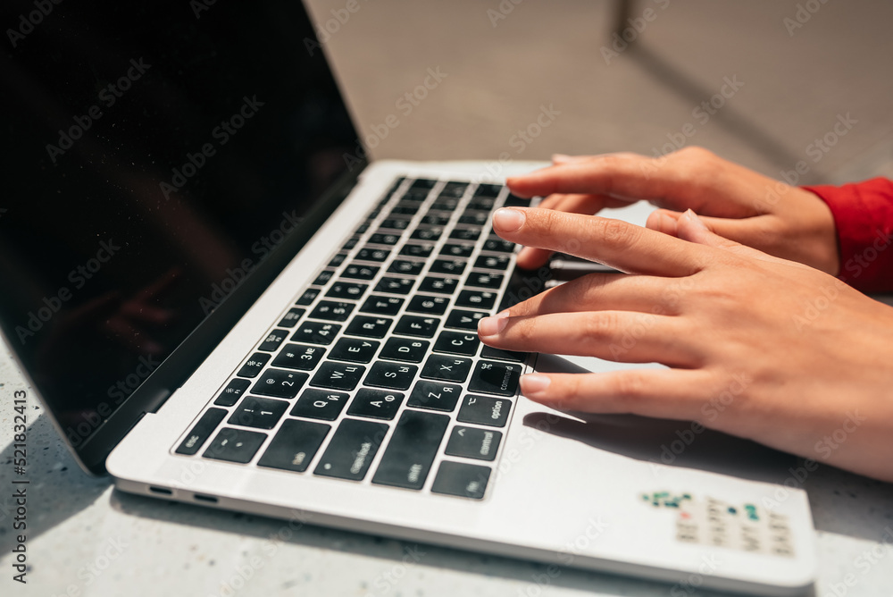 Freelance woman in summer cafe working on laptop. Freelance woman in summer cafe working on laptop.
