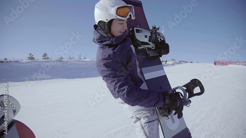 Young couple with snowboards on the snow,4K photo