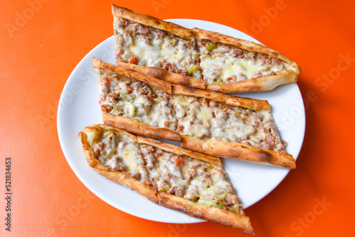 Kiymali pide. Turkish pide with minced meat. Turkish pizza mince pita Pide on white background. Etli ekmek. Kusbasi kasarli pide.