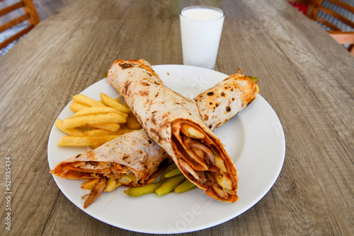 Lavash doner kebab ( zurna tavuk et doner durum )  or shawarma sliced in plate isolated.  photo