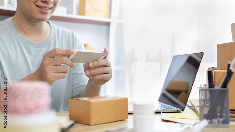 Man taking a photo of product in box postbox with a mobile phone, Identity verification or order confirmation, Business style for working at home, Working at home and owning businesses. Man taking a photo of product in box postbox with a mobile phone, Identity verification or order confirmation, Business style for working at home, Working at home and owning businesses.
