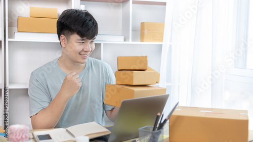 Man was happy after receiving an order from an internet customer, New business style for young people working at home and owning businesses, Online shopping SME entrepreneur, Packing box, Sell online.