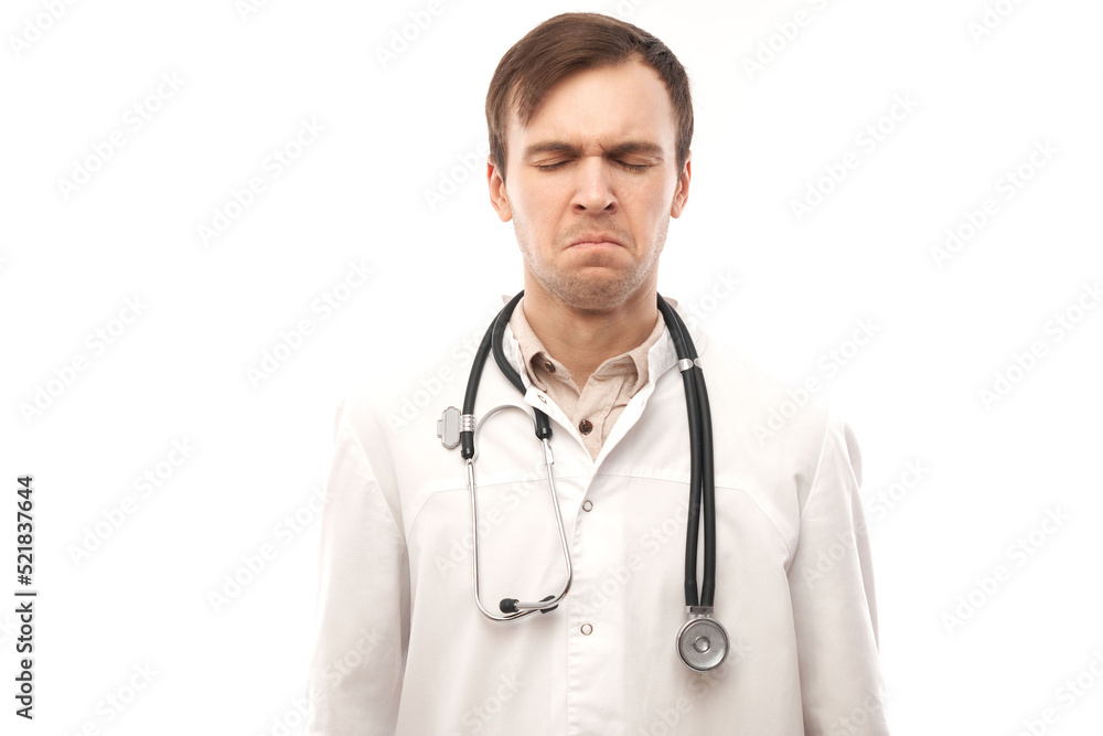 Portrait of angry doctor in white medical coat with stethoscope upset face screaming on white background with copy space Portrait of angry doctor in white medical coat with stethoscope upset face screaming on white background with copy space