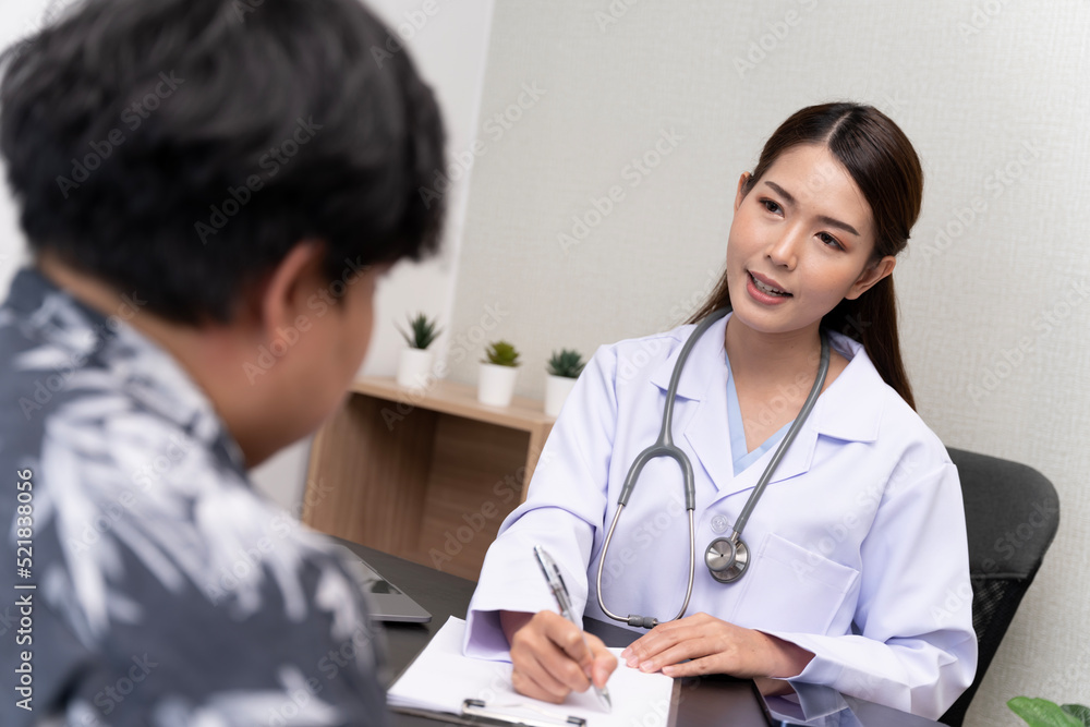 A beautiful Asian doctor discusses the condition of a male patient being hospitalized. A beautiful Asian doctor discusses the condition of a male patient being hospitalized.
