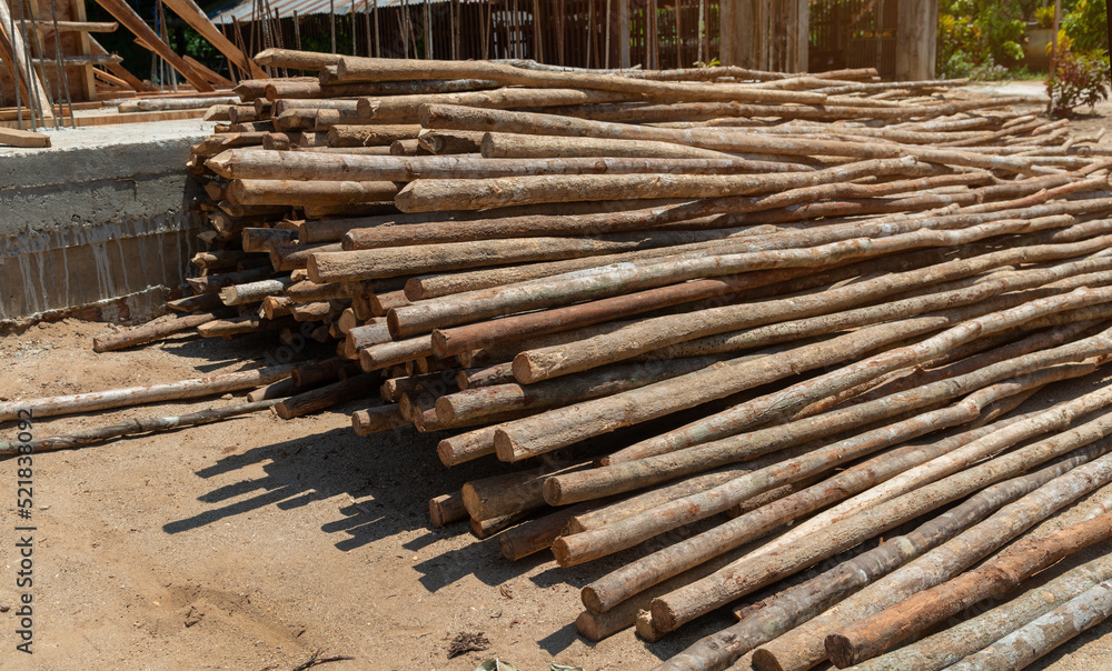 Eucalyptus wood used to support labours and material in the construction, eucalyptus wood used to support labours and material in the construction. Eucalyptus wood used to support labours and material in the construction, eucalyptus wood used to support labours and material in the construction.