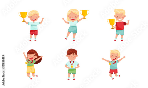 Cute Little Boy and Girl with Gold Medal and Cup as Achievement Award Vector Set
