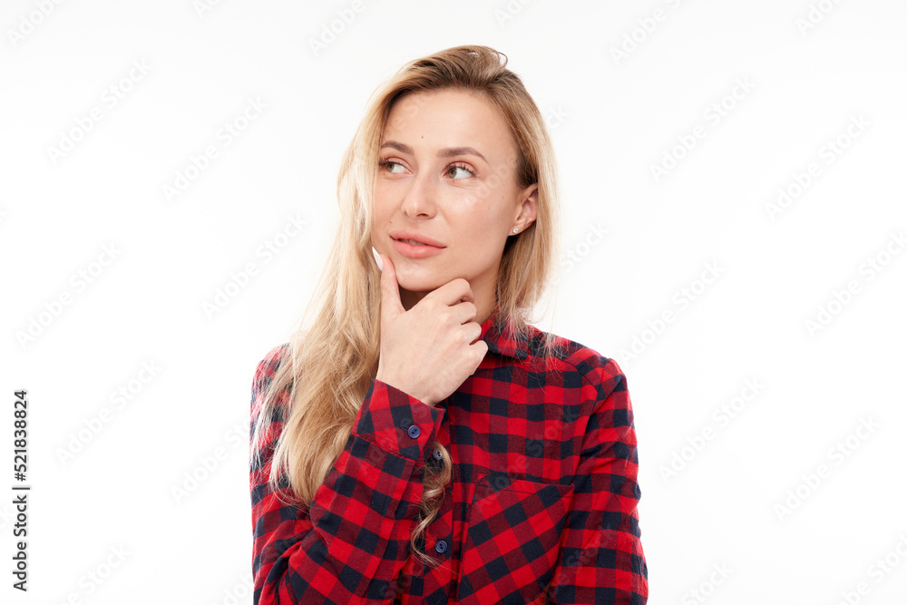 Smart blonde girl in casual holding chin thinks doubts, makes decision isolated on white studio background Smart blonde girl in casual holding chin thinks doubts, makes decision isolated on white studio background