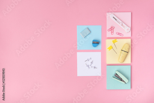 The concept of Back to school. School stationery on a pink background, background