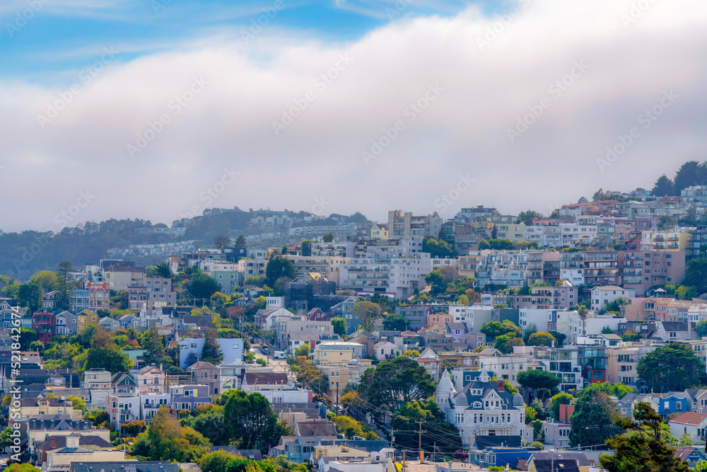 Sloped suburbs of San Francisco, California with large apartment buildings Sloped suburbs of San Francisco, California with large apartment buildings