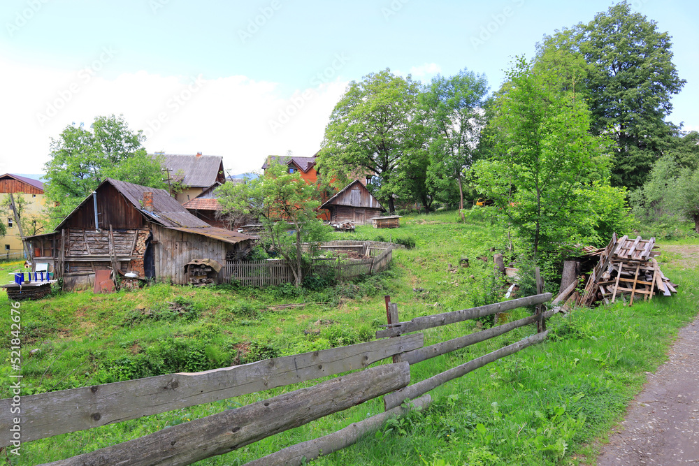 Wooden house in rainy day in Yaremche, Ukraine Wooden house in rainy day in Yaremche, Ukraine