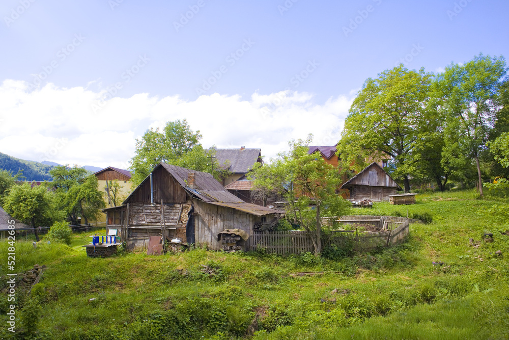 Wooden house in sunny day in Yaremche, Ukraine	

